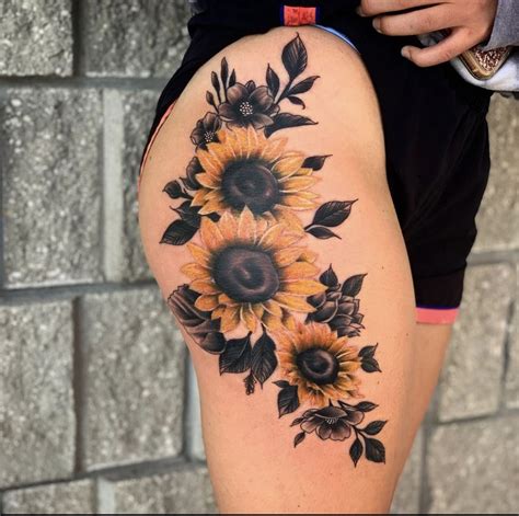 sunflower thigh tattoo